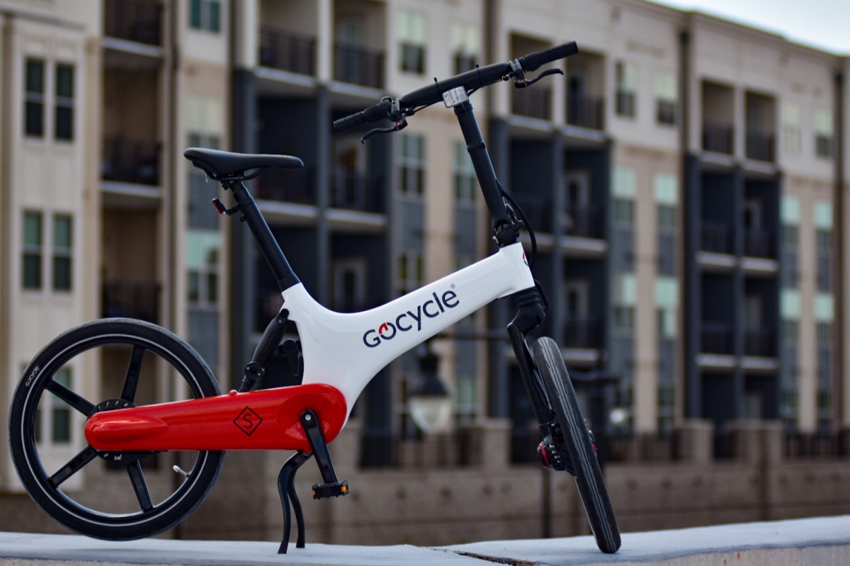Gocycle folding electric bike parked outside a downtown Pensacola apartment building